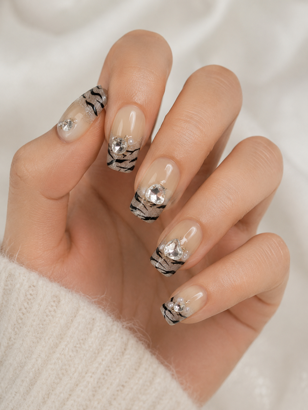 Naile Haus Luxe Safari Press-On Nails | Nude Zebra Print French Tips with Rhinestones & Pearl